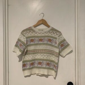 Feminine Cider short-sleeved crew neck sweater with floral and cutout details